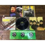 An assorted mix of five 12" vinyl LPs including titles such as; The Beatles "Please Please Me",