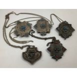 Five various Tibetan / Nepalese white metal Gau amulet pendants inlaid with red and blue / turquoise