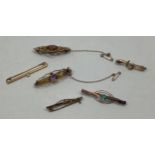 Six various brooches including two sweetheart brooches with amethyst coloured stones (one tests as