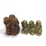 A carved wooden figure-group depicting the Three Wise Monkeys back to back in a circle, 7cm tall,