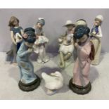 Two Lladro porcelain figures of Oriental girls, raised on circular pedestal bases, together with