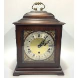 A German walnut cased mantel clock with silvered chapter ring and central face marked 'St James