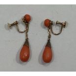 A pair of yellow metal (tests as 9ct gold) and coral drop earrings, with screw on backs, circular