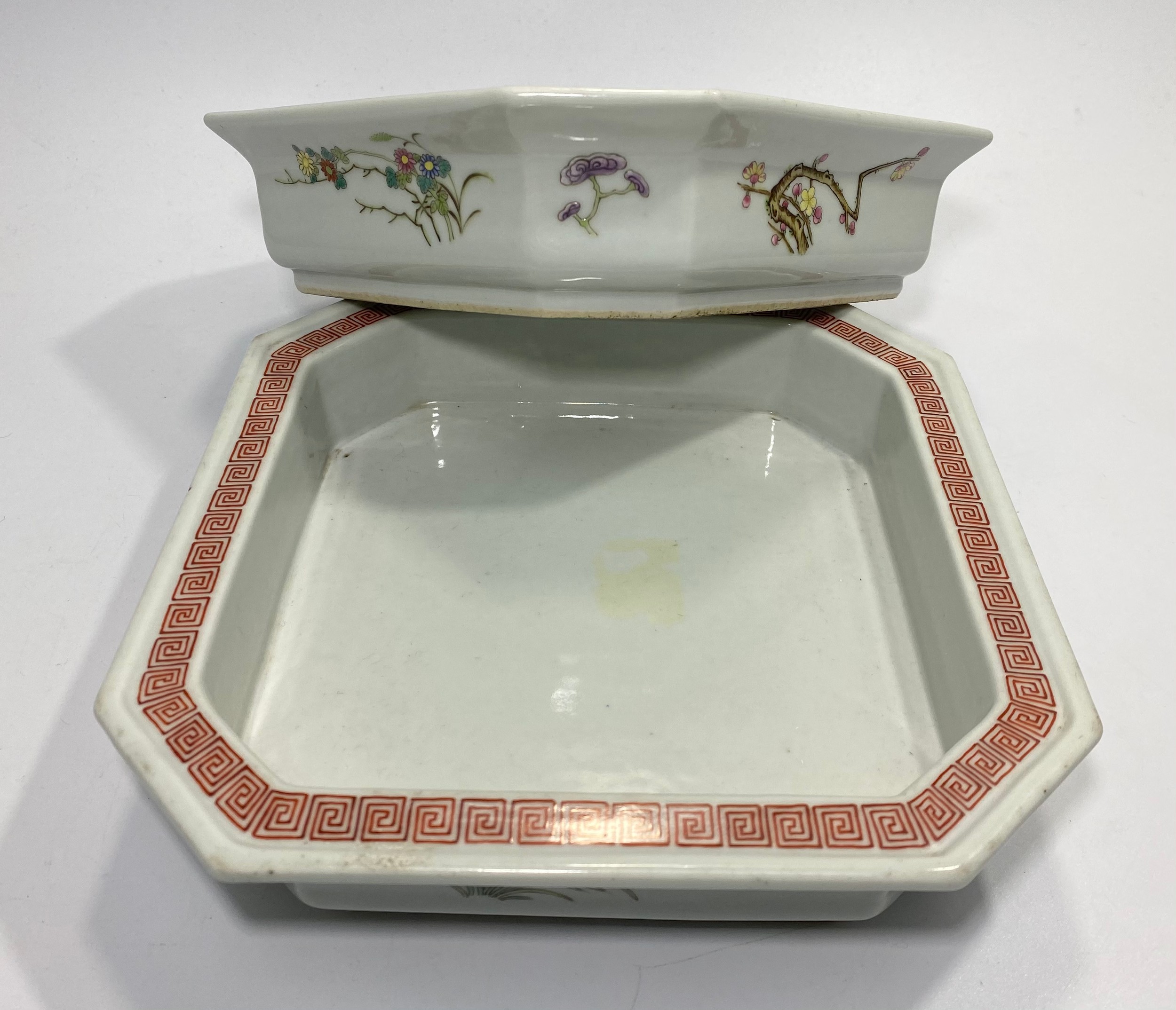 A pair of Chinese porcelain square shallow dishes with canted corners, painted stylised cloud
