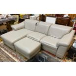 A contemporary grey leather upholstered suite comprising a large three-seater corner sofa, with