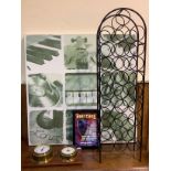 A Matt black painted metal wine rack, with domed top, raised on four supports, 110cm tall,