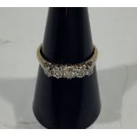 An 18ct gold five-stone graduated diamond ring, round brilliant cut, claw set, estimated total