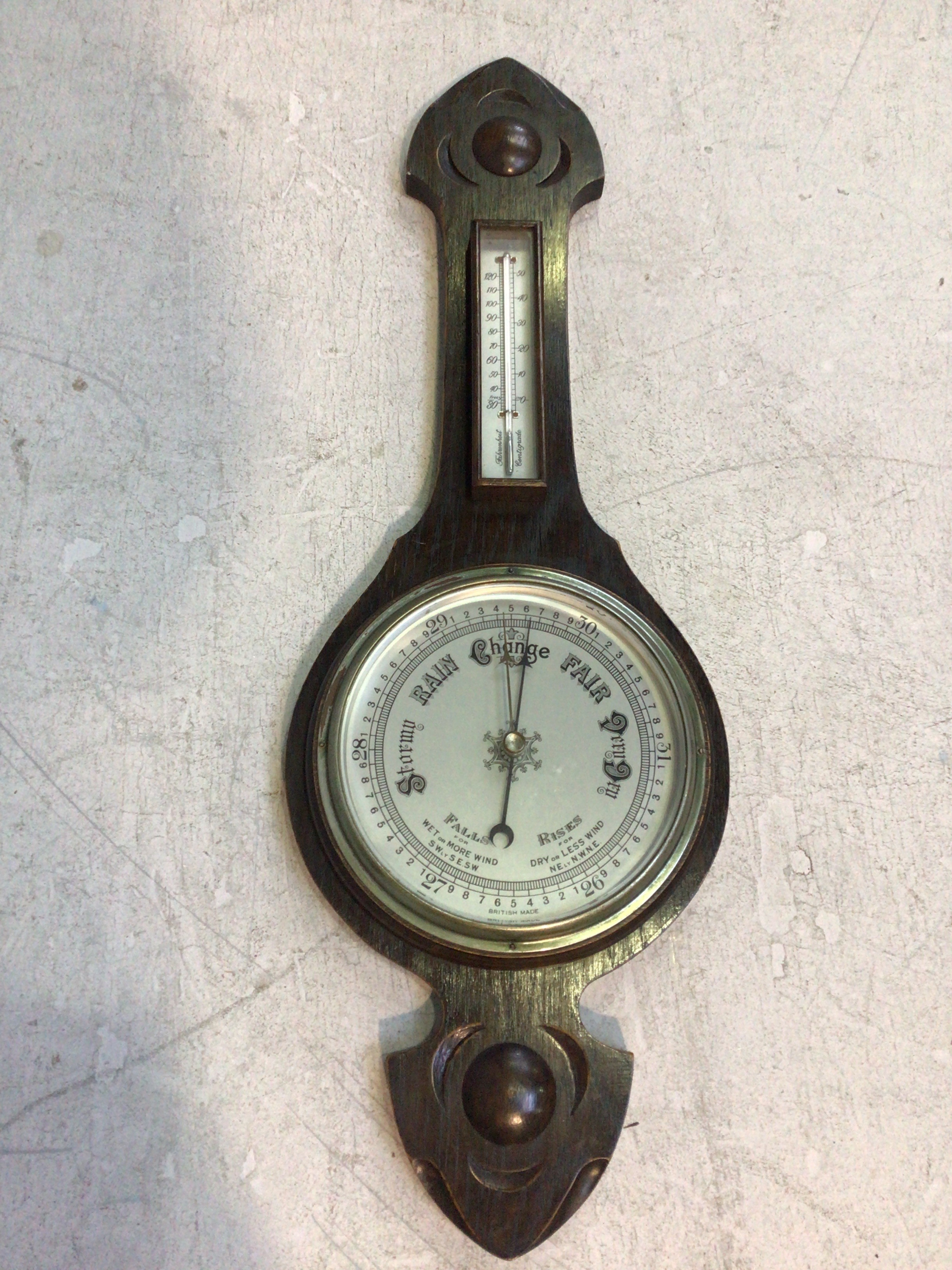 An aneroid banjo barometer with silvered dial and thermometer, 80cm high