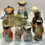 Ten various Toby / character jugs including a stoneware Mr Punch, treacle glazed lady, pewter lidded