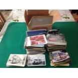 Three cardboard boxes containing very approximately 2,100 photos and postcards of British transport,