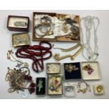 A collection of assorted costume jewellery comprising a silver crucifix, various ladies