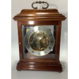 A German mahogany cased mantel clock with silvered and brass edged chapter ring, subsidiary