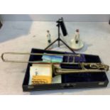 B-flat-F base trombone with extended range by Conn with hard case, mouthpiece, two mutes, music