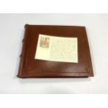 An Asprey & Garrard grained, tan leather bound photograph album, in original branded box with