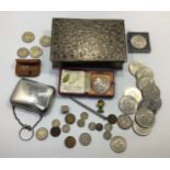 A Victorian silver purse and 1889 silver crown, together with a silver bracelet charm containing a