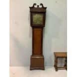 An 18th century oak long case clock, the hood with swan neck pediment supported by doric columns,
