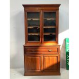 An Edwardian stained walnut secretaire bookcase with sliding top drawer enclosing writing scribe,
