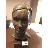 Collectables : A women's head/bust on a wooden pli