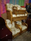 A cane and rattan framed Conservatory Suite comprising a two-seater settee,