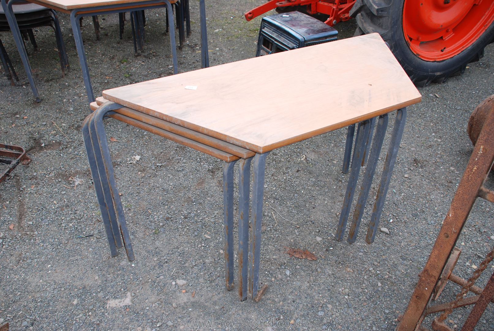 Three stacking school tables,