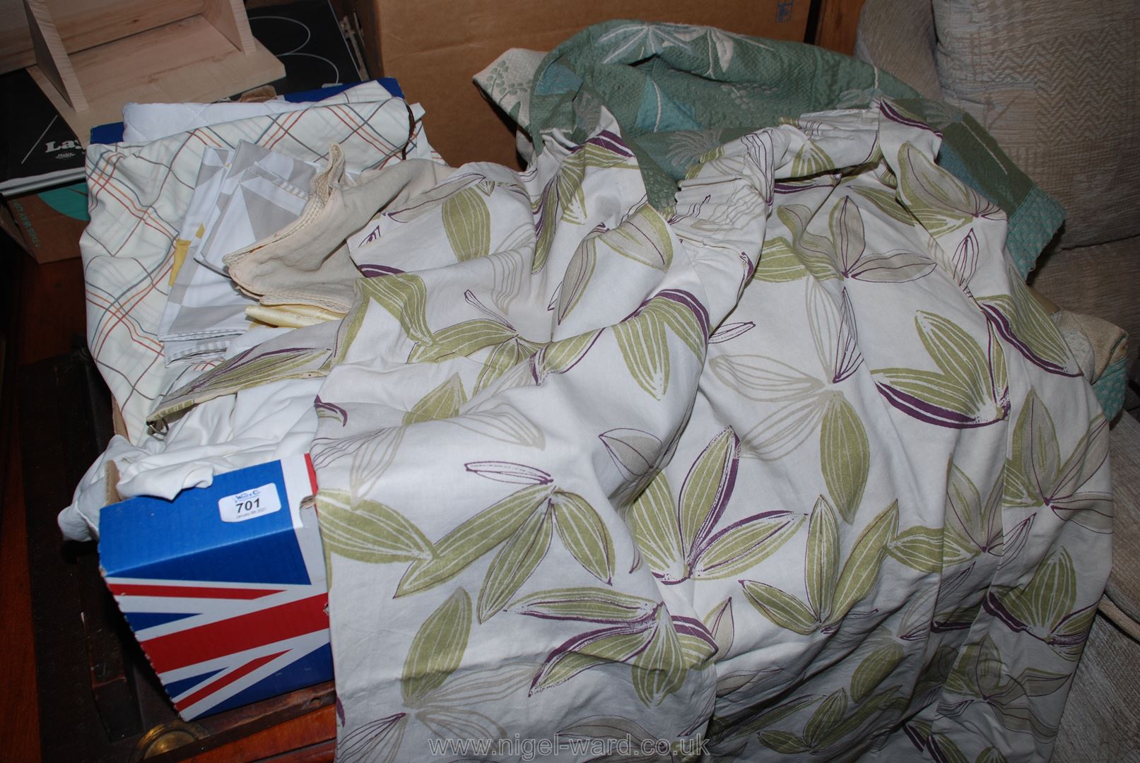 A quantity of curtains, bed linen, fabric, etc.