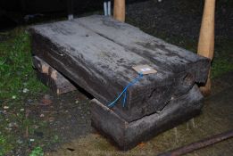 Railway sleeper cut into a stand