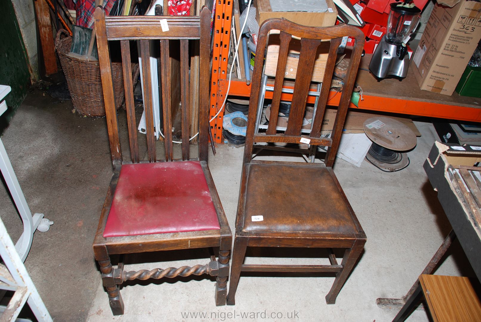 Two Oak framed dining chairs.