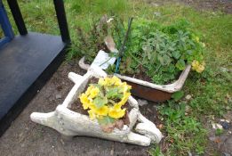 Small planted wheelbarrow and a bowl of herbs