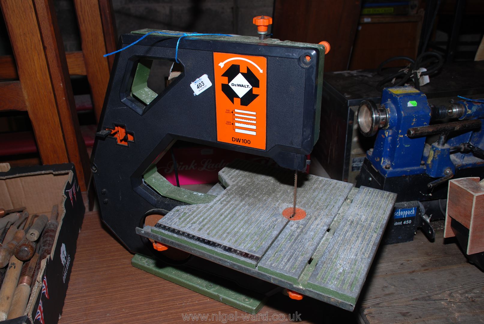 A "DeWalt DW100" band-saw.