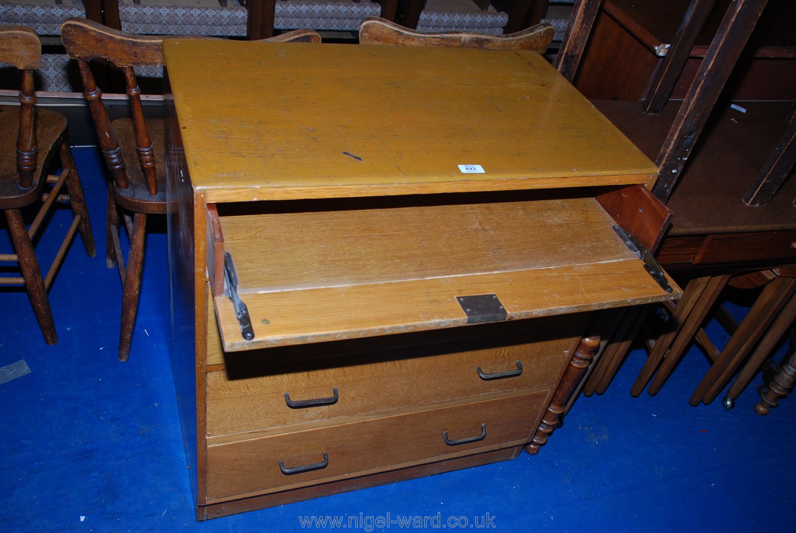 A light Oak finished chest of four long drawers, the top drawer having a fall front. - Image 2 of 2