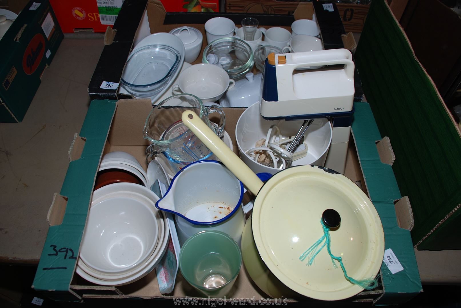 An enamelled saucepan, a "Kenwood" hand mixer, mixing bowls, etc.