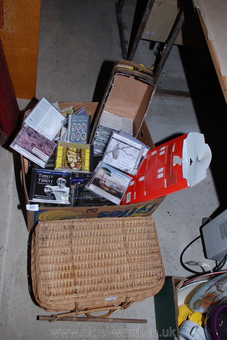 A wicker basket and a large quantity of unopened classical C.D.'s, etc.