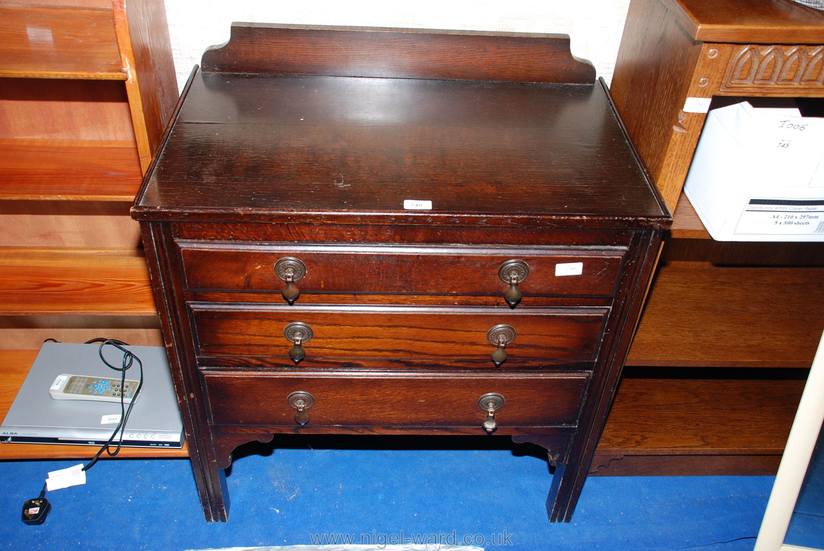 A dark Oak finished three-drawer chest of drawers, 29" x 18" x 32" high.