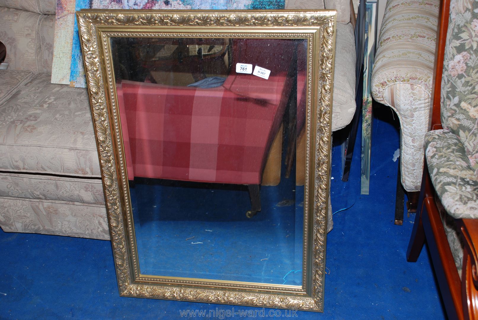 A framed bevel plated wall mirror, 24" x 34".