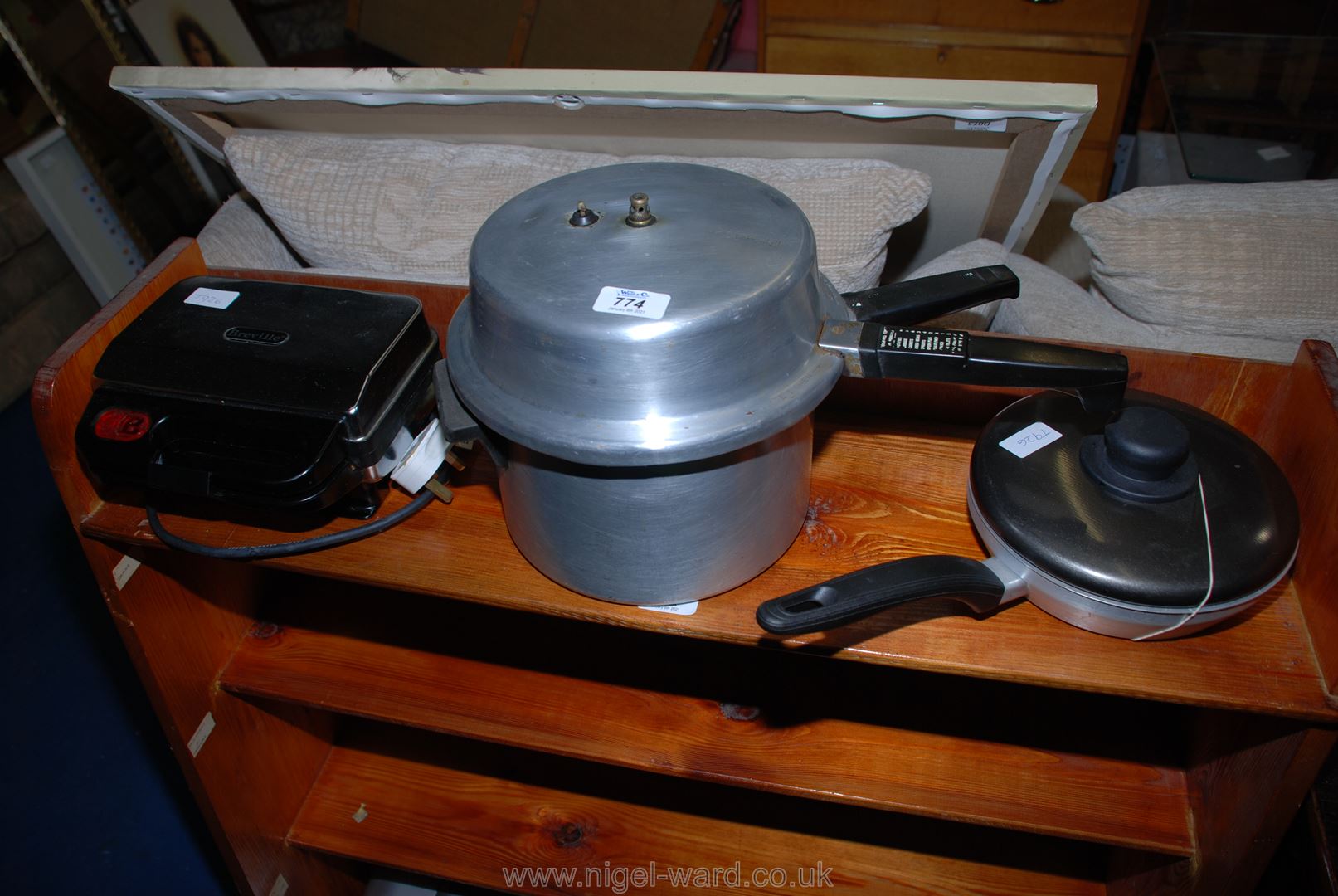 A pressure cooker, a sandwich toaster and an egg poacher.