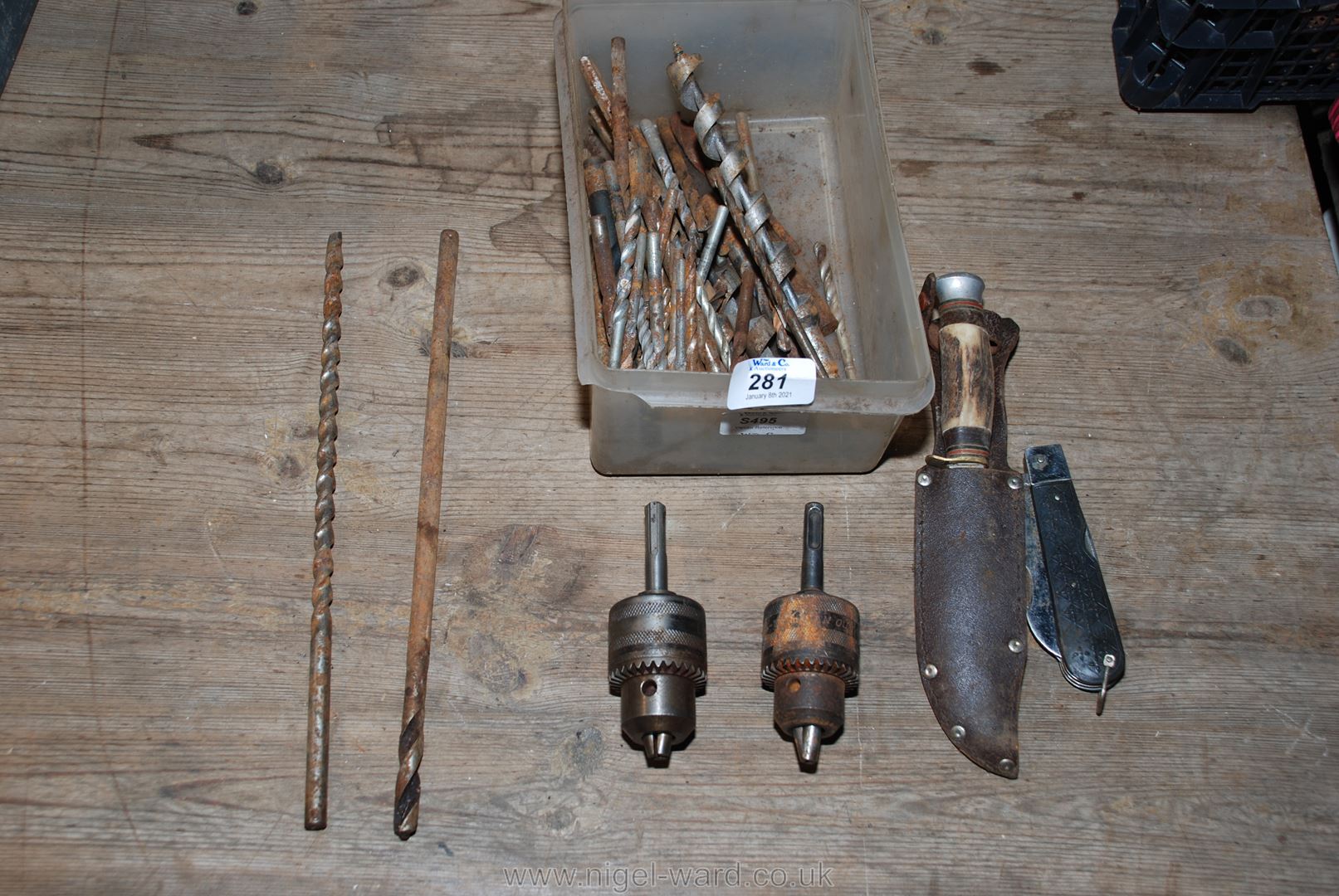 Quantity of drill bits, knives and an SDS chuck adaptor.