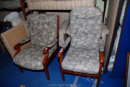 A two-seater upholstered settee and two upholstered chairs.