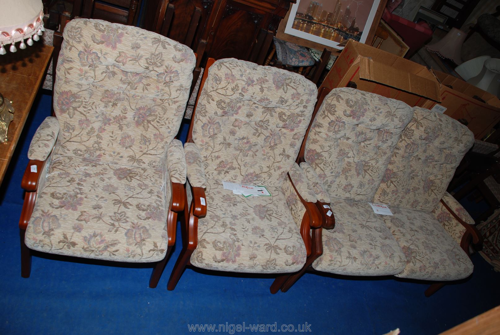 Two "Cintique" Winchester style armchairs and a matching two-seat sofa.