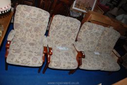 Two "Cintique" Winchester style armchairs and a matching two-seat sofa.