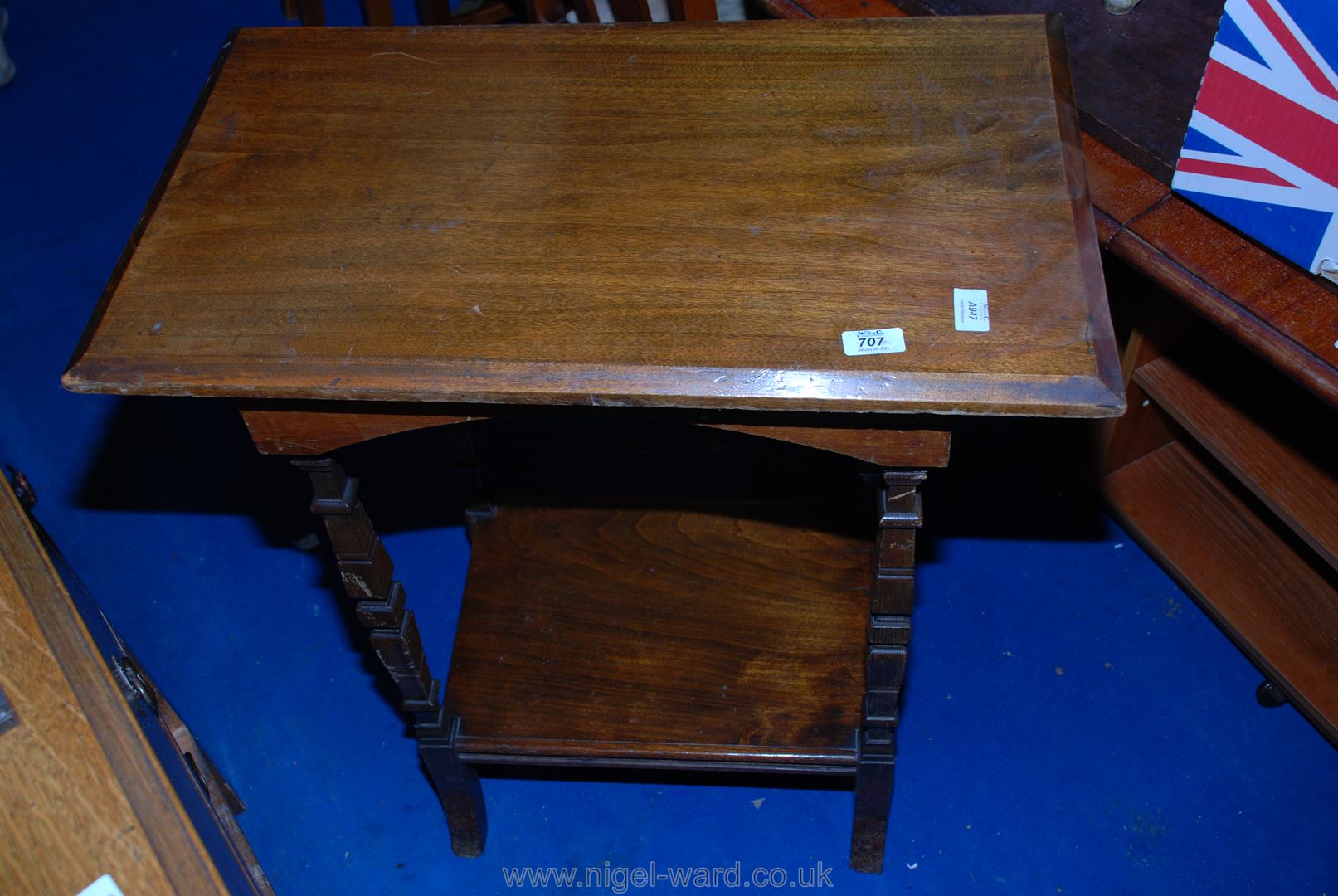 A rectangular Mahogany table with under shelf having unusual square tapered legs 27" x 16" x 31"