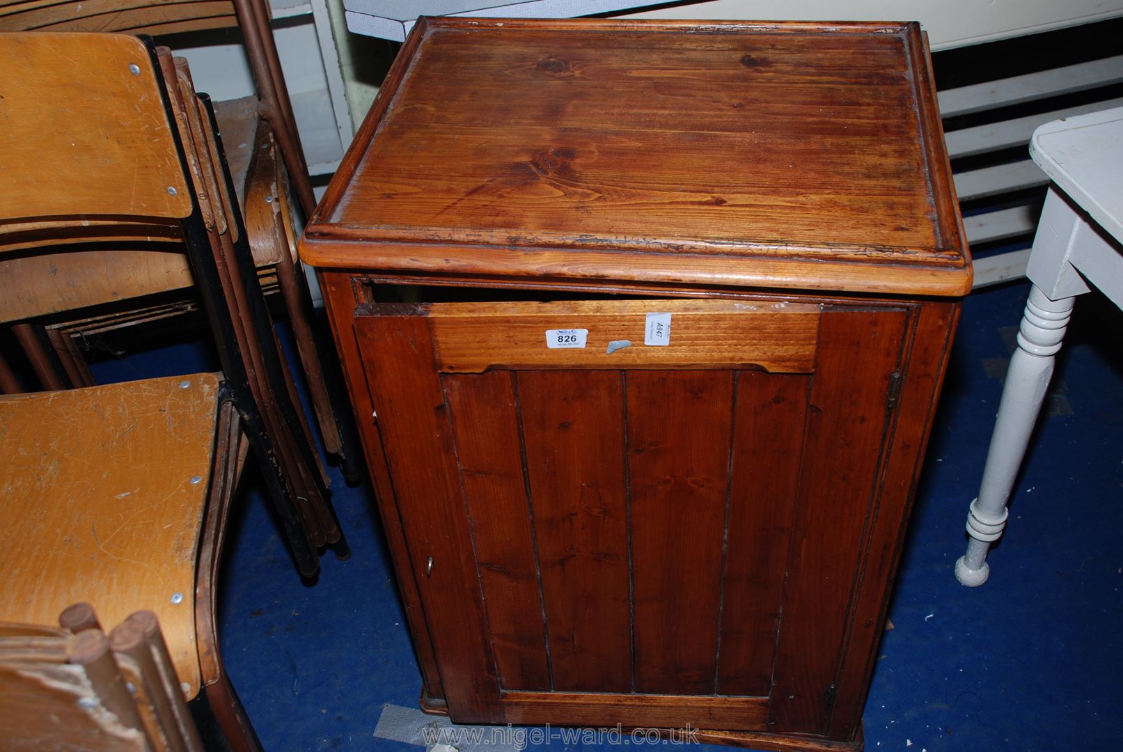 A Pine plank-style single-door, three shelf cupboard, 22" x 17 1/2" x 31" high.