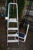 A three rung step ladder and a step stool.