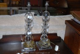 A pair of glass table lamps.