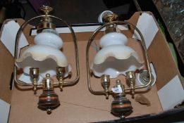 Pair of oil lamp-style ceiling lights.