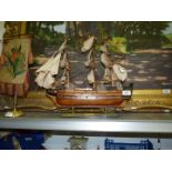 A model of H.M.S Victory on wooden plinth 20'' long x 16'' high.