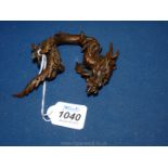 An oriental bronze three toed dragon, 10'' long, an embellishment from a larger piece.