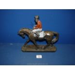 A composite model of a horse and jockey on plinth, 11'' tall.