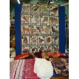 A quantity of fabric including tie dye designs and woven wall panel of the alphabet measuring 47''