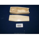 A Scrimshaw bone coffin with articulated model of a skeleton within,