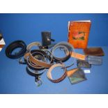 A quantity of leather belts, purses, key holder, comb holder and mobile phone carrier, etc.